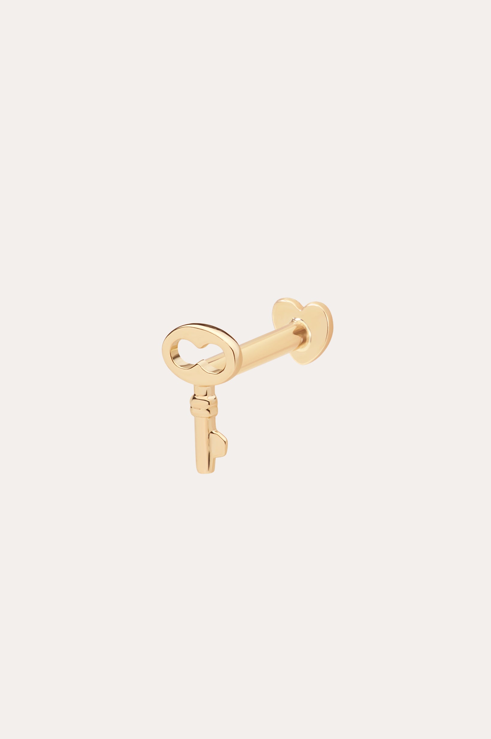 The 14K Solid Yellow Gold Key Flat Back Stud features a heart-shaped bow and is shown in 14K yellow gold against a simple, light background.