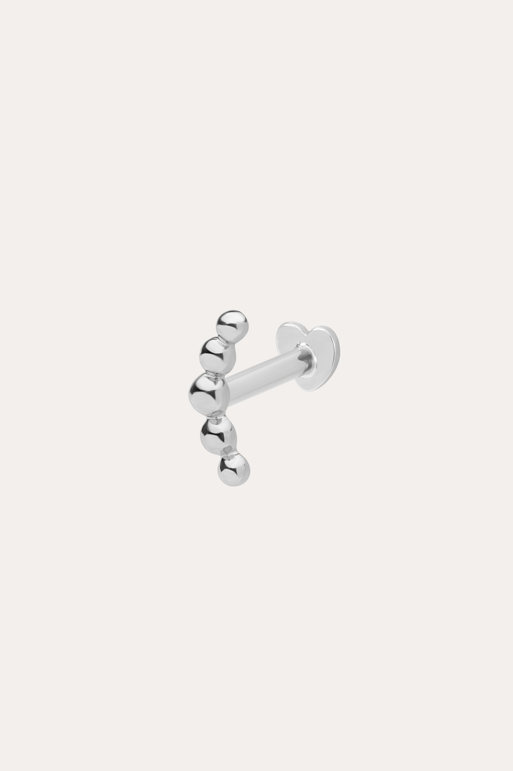 The 14K Solid White Gold Curved Ball Flat Back Stud features six shiny round beads in a curved line, shown on a plain white background—an elegant choice for body jewellery.