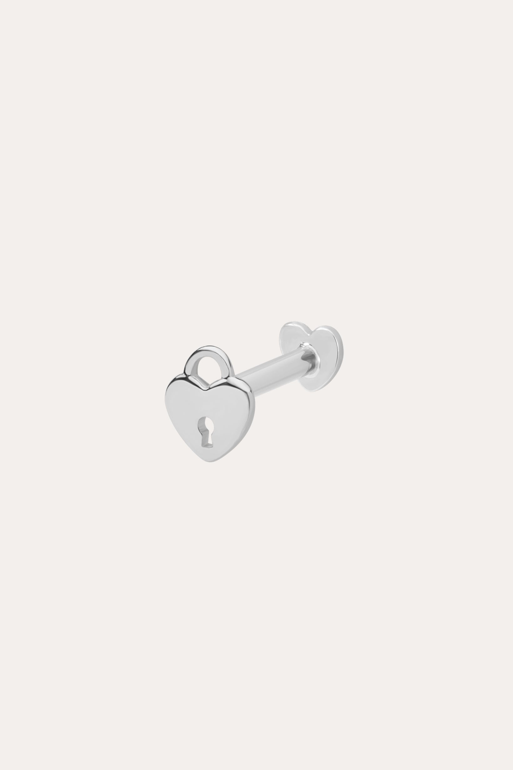 The 14K Solid White Gold Lock Flat Back Stud features a heart-shaped padlock with a central keyhole design, set against a plain white background—an elegant addition to your body jewellery collection.