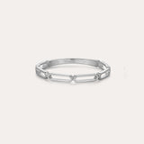 The Aisha Paperclip Stacking Ring in Silver showcases a sleek, open geometric link design and is displayed against a simple light backdrop.