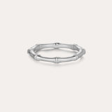 The Bamboo Ring in Silver is a slender band crafted from recycled sterling silver, featuring subtle joint details and showcased on a plain light background.