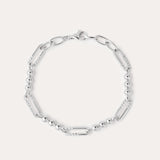 The Carly Paperclip Chain Bead Bracelet in Silver features alternating elongated oval links and small round beads, showcased in a circular arrangement on a plain light background.