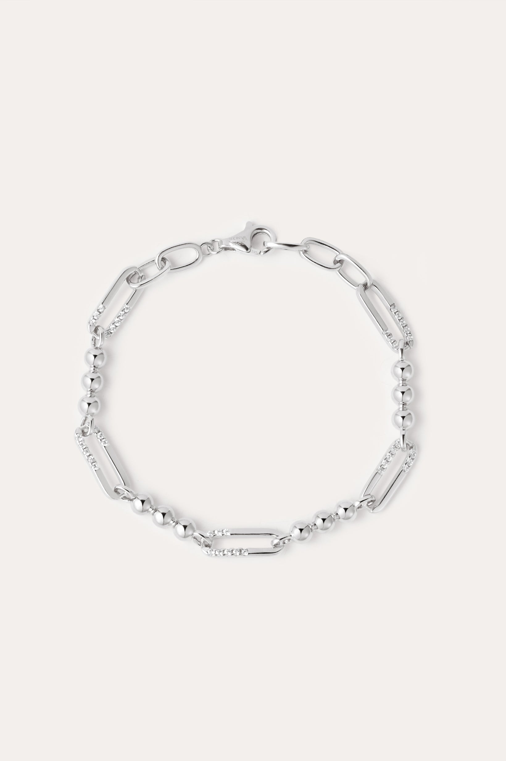 The Carly Paperclip Chain Bead Bracelet in Silver features alternating elongated oval links and small round beads, showcased in a circular arrangement on a plain light background.