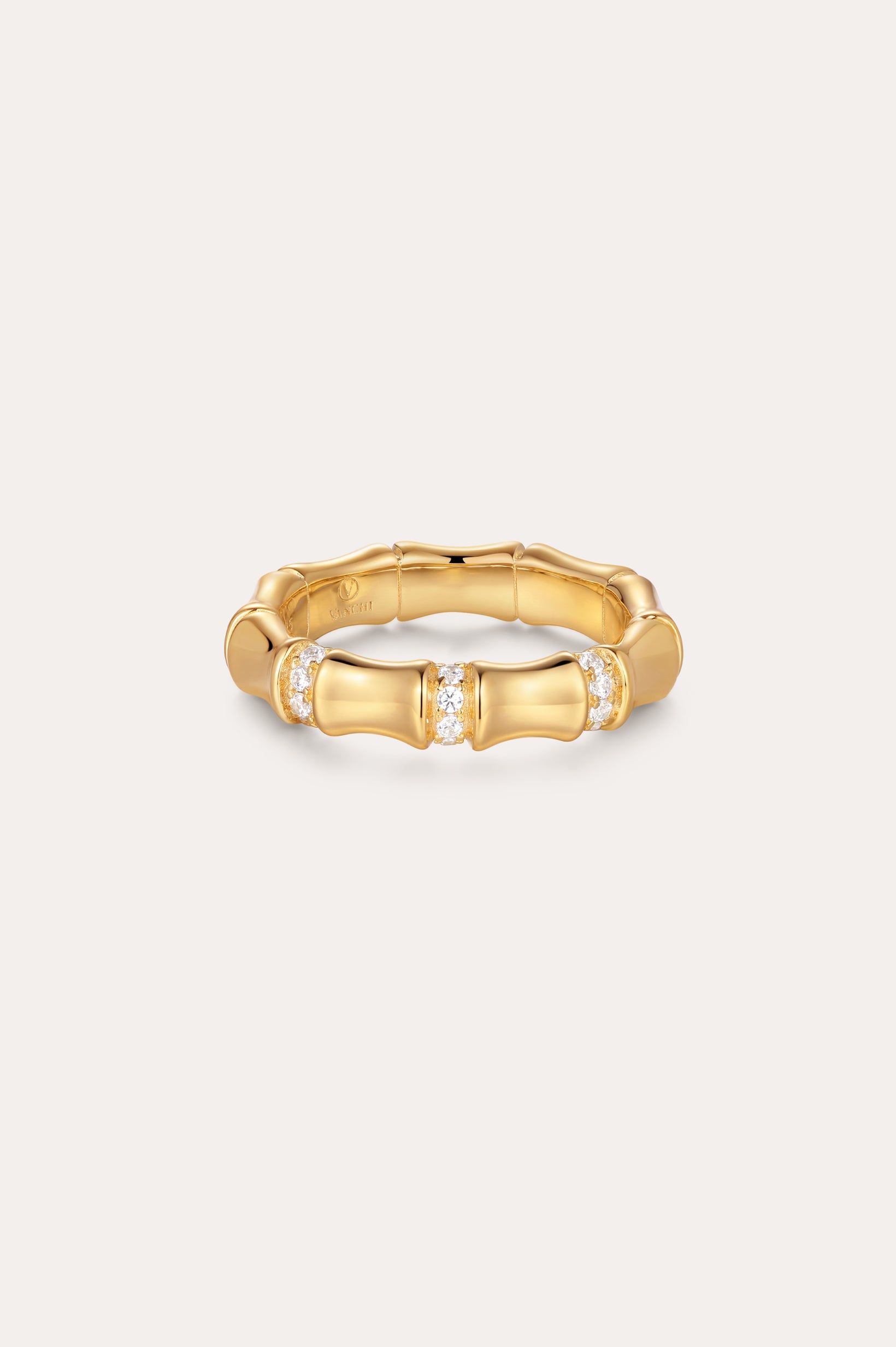 The Bamboo Chunky Crystal Ring in Gold, crafted to mimic bamboo stalks and accented with three sparkling crystal clusters, is made from recycled sterling silver finished in radiant gold and displayed on a simple light background.