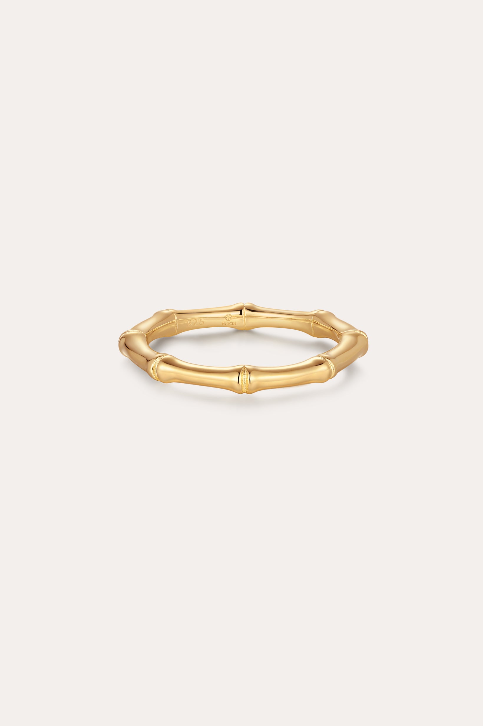 The Bamboo Ring in Gold features smooth, rounded segments in a slim, gold-plated design—perfect for minimalist jewelry lovers and shown on a simple light background.
