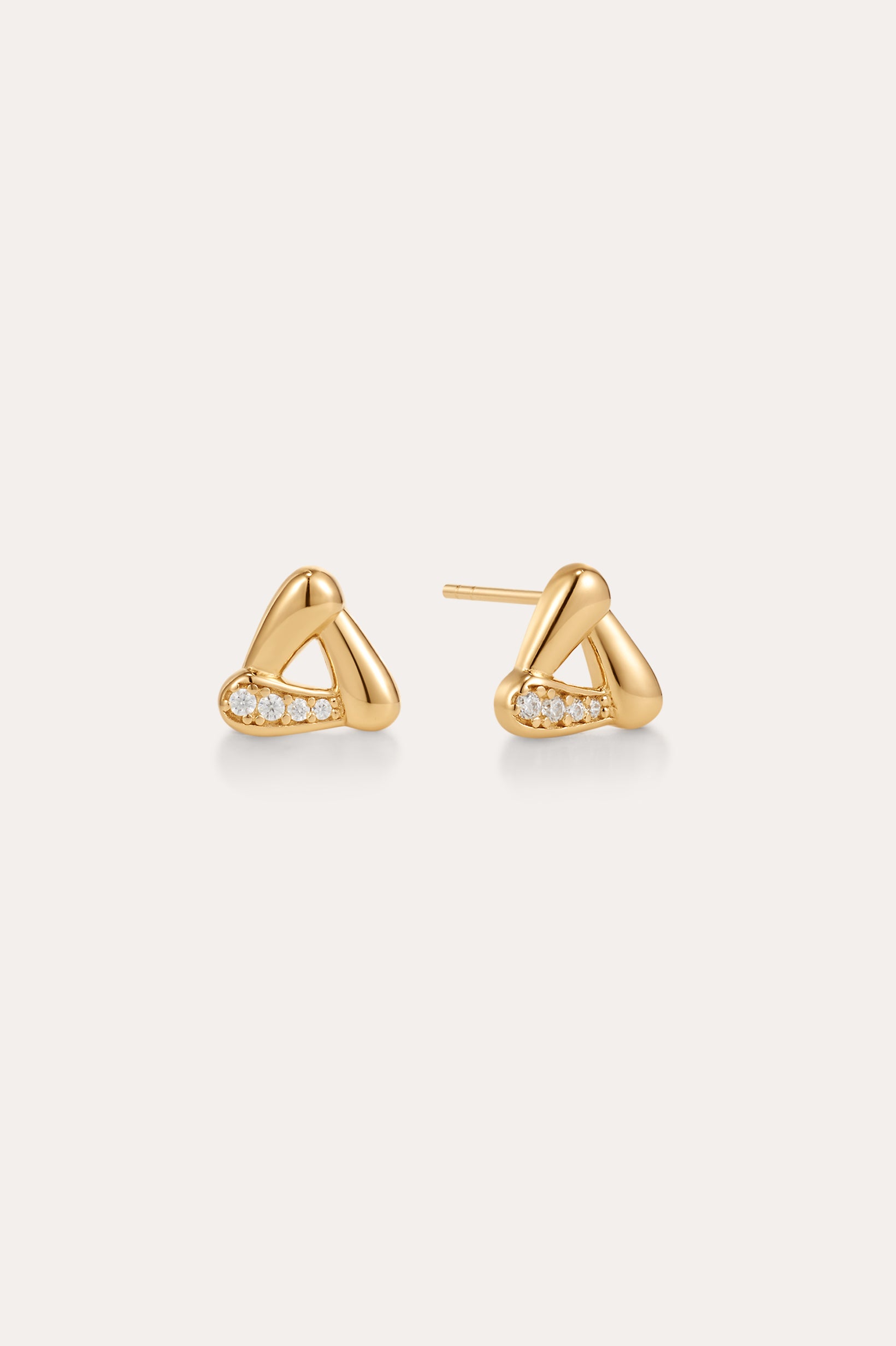 A pair of Colette Droop Link Studs in Gold, designed in a rounded triangular shape with three small diamonds set along one side, displayed on a plain light background.