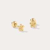 The Fleur Flower Barbell Stud Piercing in Gold features small, six-petal floral studs, ideal for ear stacking and shown on a simple white background.