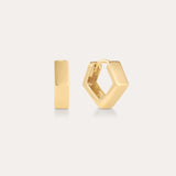 The Judith Hexagon Angular Huggies in Gold are 18k gold plated hoop earrings with a modern, angular design, shown against a light background—one earring is front-facing, the other highlights its side profile and clasp.
