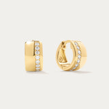 The Juni Pavé Chunky Hoop Earrings in Gold are 18k gold-plated hoops, each accented with a central vertical row of sparkling pavé diamonds, shown against a simple light background.