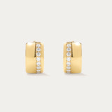 The Juni Pavé Chunky Hoop Earrings in Gold feature a modern rectangular shape, 18k gold plating, and a vertical row of sparkling CZ crystals on each polished huggie hoop.
