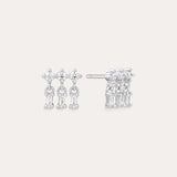 The Lexi Crystal Studs Earrings in Silver showcase three vertical rows of sparkling cubic zirconia in a geometric design, displayed on a neutral background.