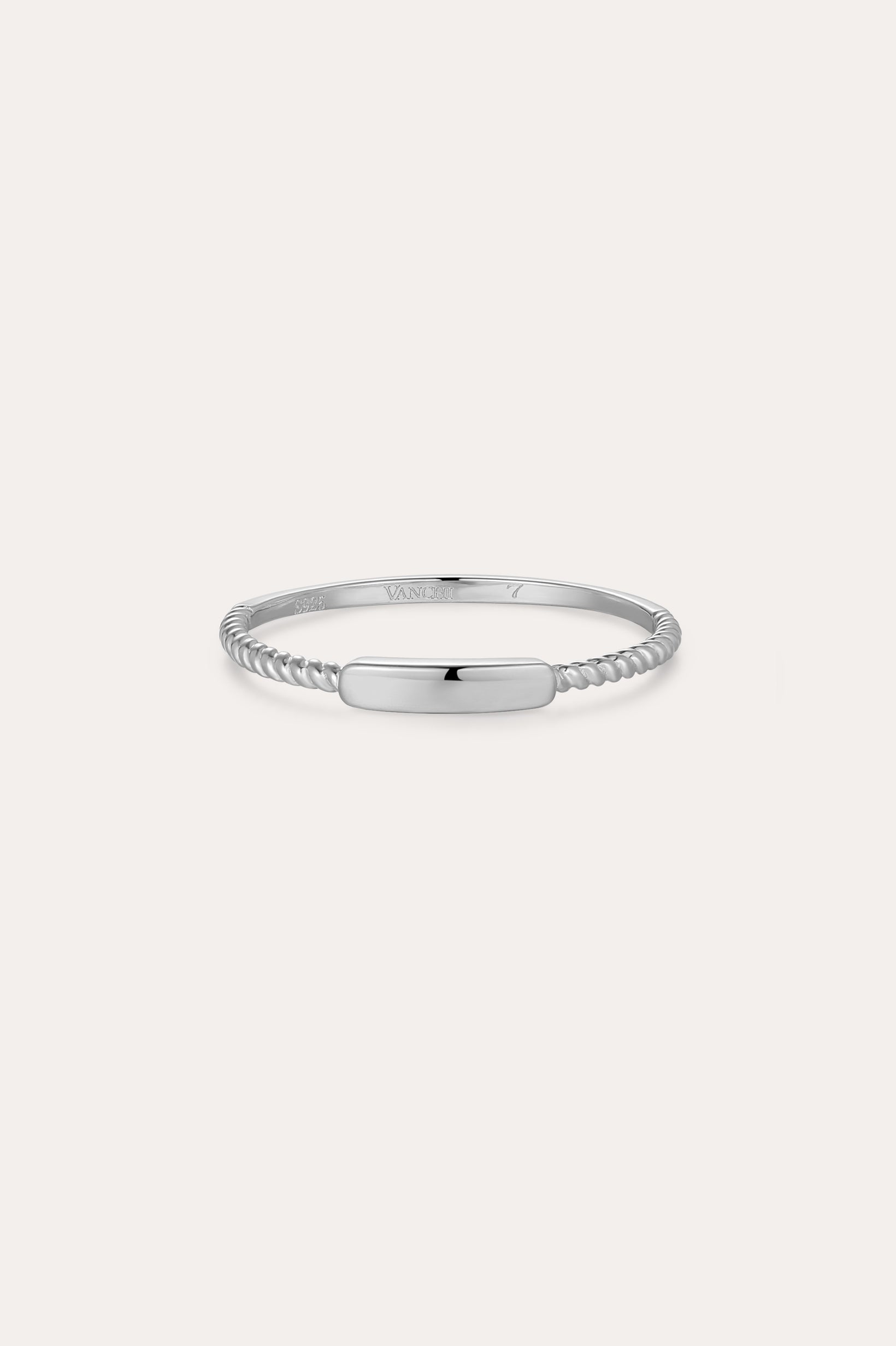 The Lya Horizontal Bar Stacking Ring in Silver features a smooth, polished rectangular center plate and twisted bands on each side—ideal for stacking—and is shown against a plain white background.