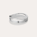 The Noor Pavé Triple Band Ring in Silver showcases a modern overlapping design with a polished finish and a row of sparkling pavé diamonds along one edge, elegantly set against a light background.