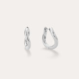 A pair of small, polished Nori Twisted Hoop Earrings in Silver with an infinity-like twist design, displayed on a light background. One sterling silver hoop faces front; the other is sideways to show the clasp.