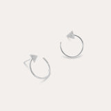 Reneé Triangle Linear Hoop Stud Earrings in Silver feature small textured triangles at the ends of sleek hoops, shown on a plain light background.