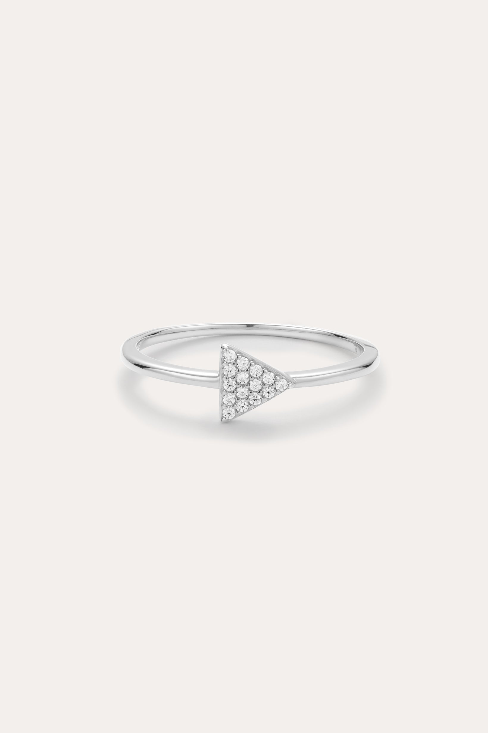 Silver ring with a triangle-shaped gemstone on a light gray background