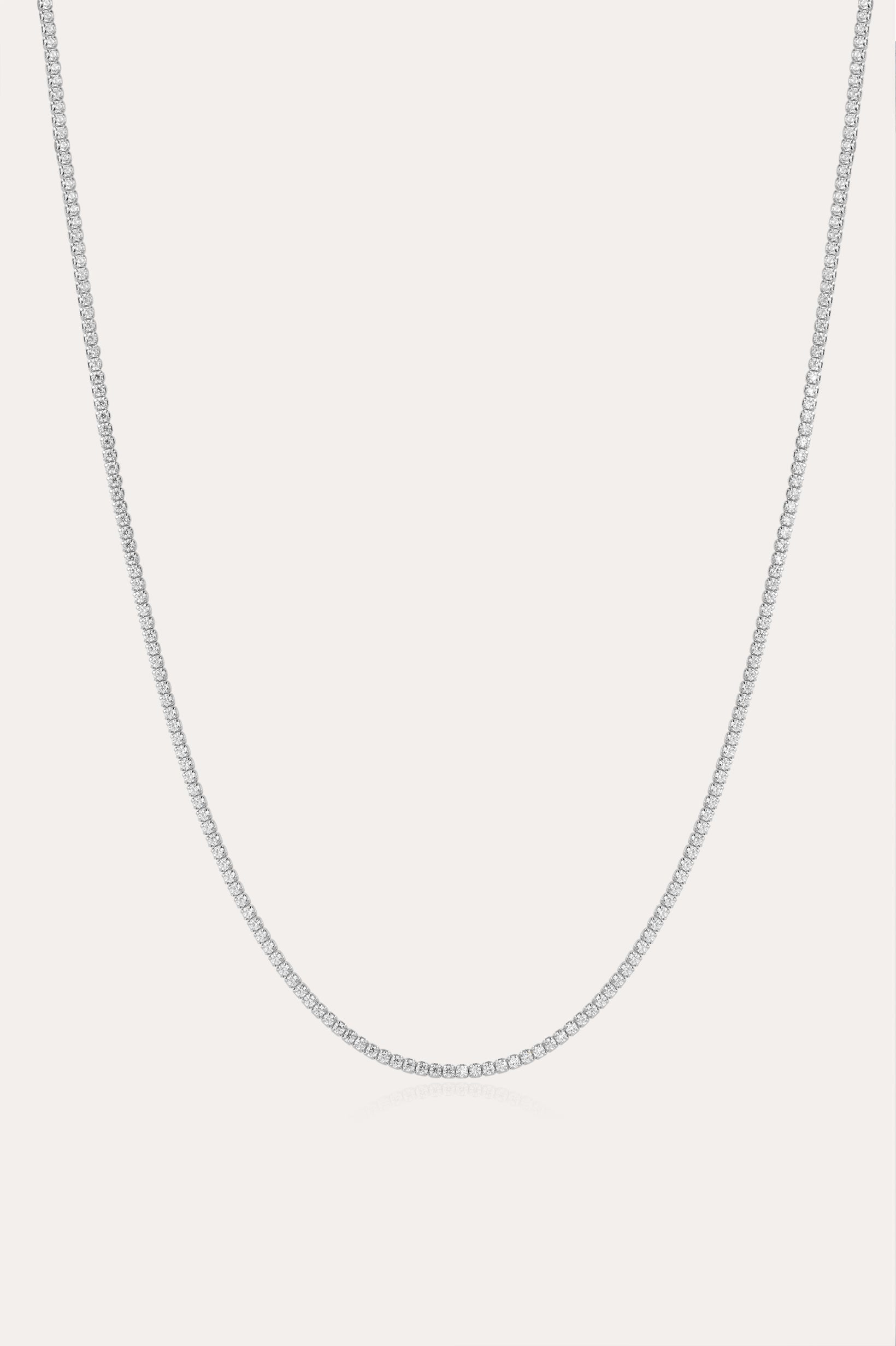 The Alba Tennis Necklace in Silver is displayed against a plain white background, highlighting its delicate and understated elegance.