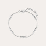 The Bamboo Chain Bracelet in Silver features small, evenly spaced cylindrical accents on a fine S925 sterling silver chain with a lobster clasp and adjustable extension. Displayed against a plain, light background.