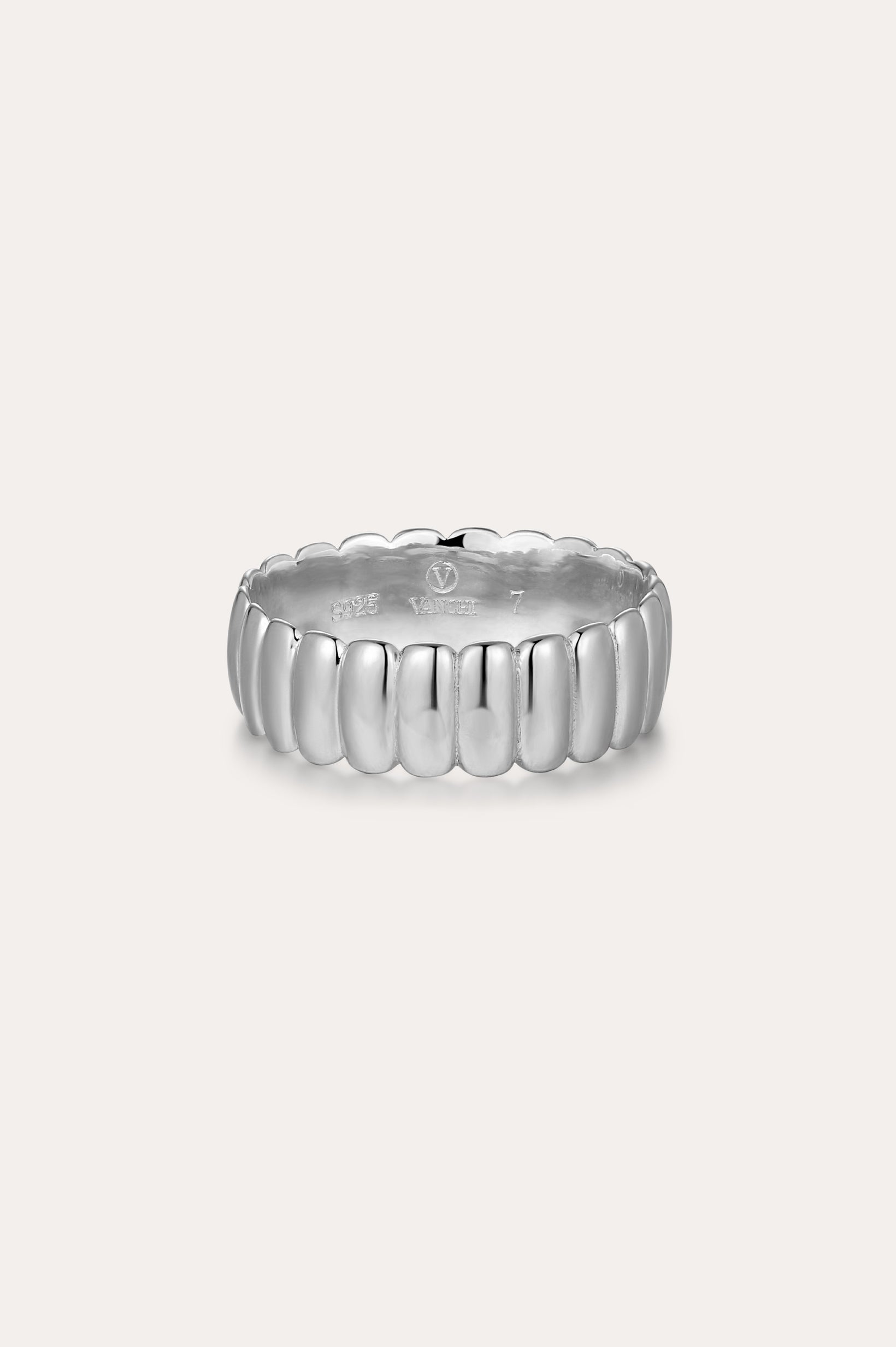 The Charlotte Eternity Ridged Ring in Silver features a rounded, ribbed design around its band and is showcased on a plain light background.