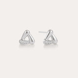A pair of Colette Droop Link Studs in Silver, with smooth, rounded triangular shapes and small embedded cubic zirconia crystals on one side, displayed on a plain light background.