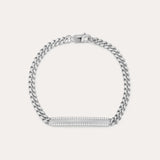 The Gisèle Cuban Link Bar Bracelet in Silver features a sterling silver Cuban link design, a rectangular bar adorned with sparkling cubic zirconia stones, and is finished with a secure lobster clasp.
