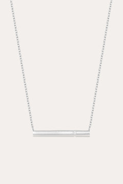 The Regina Horizontal Bar Pendant Necklace in Silver features a minimalist silver bar with a single, sparkling cubic zirconia at its center—ideal for lovers of simple, elegant jewelry.