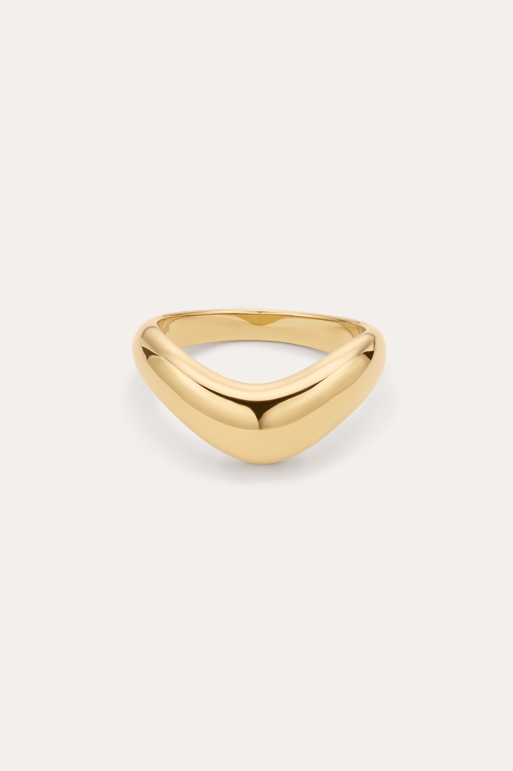 The Vava Plain Chunky Curved Wave Ring in Gold features a smooth, polished gold-plated finish with a minimalist, curved and slightly pointed front, showcased on a simple light background.