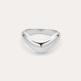 The Vava Plain Chunky Curved Wave Ring in Silver features a polished, silver V-shaped wave design with a smooth, rounded surface. Photographed against a light background, its ideal for minimalist jewelry lovers.