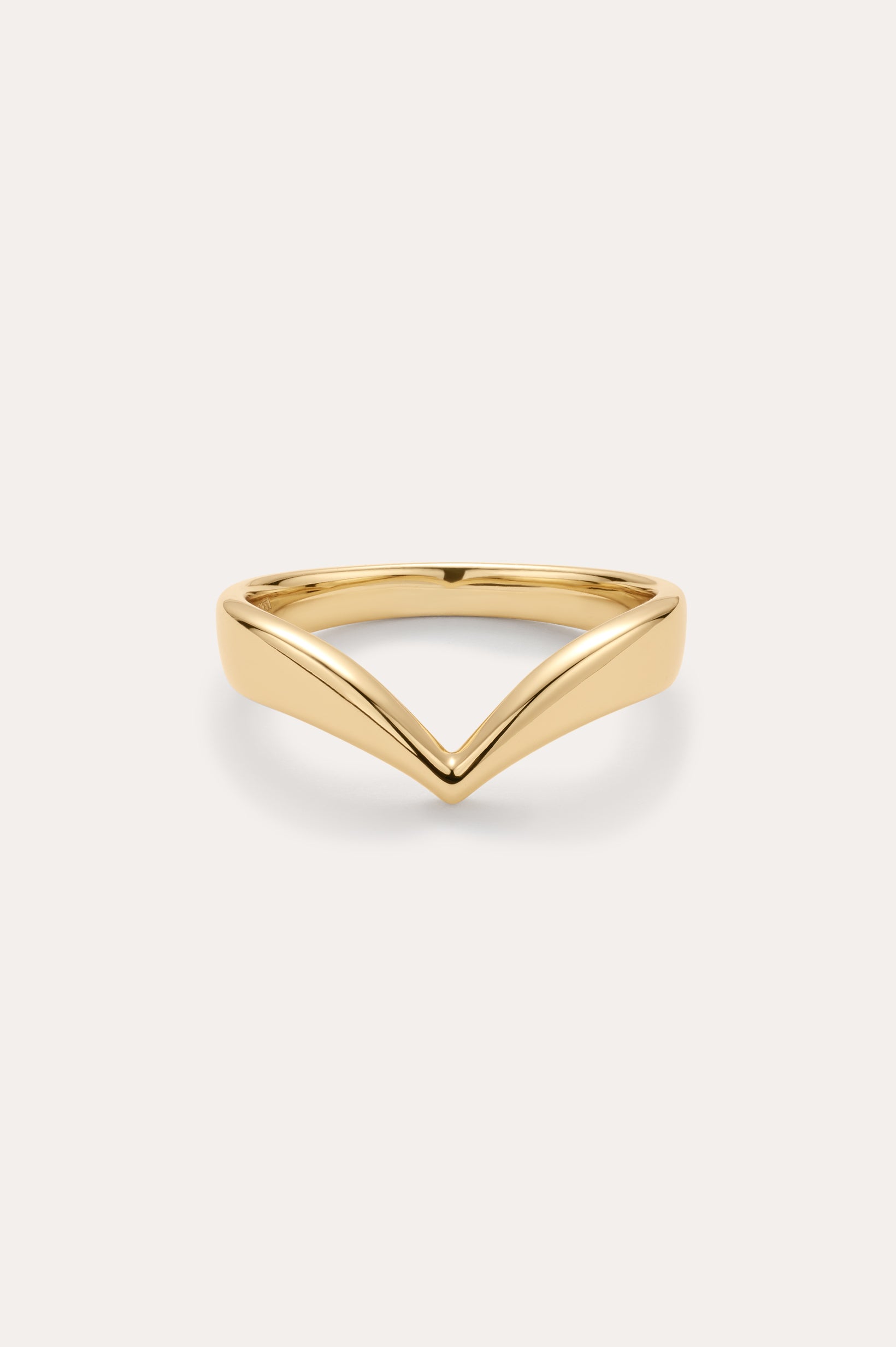 The Veda Plain Chevron Ring in Gold is a minimalist, gold-plated wishbone ring with a sleek V-shaped design, shown against a simple light background.