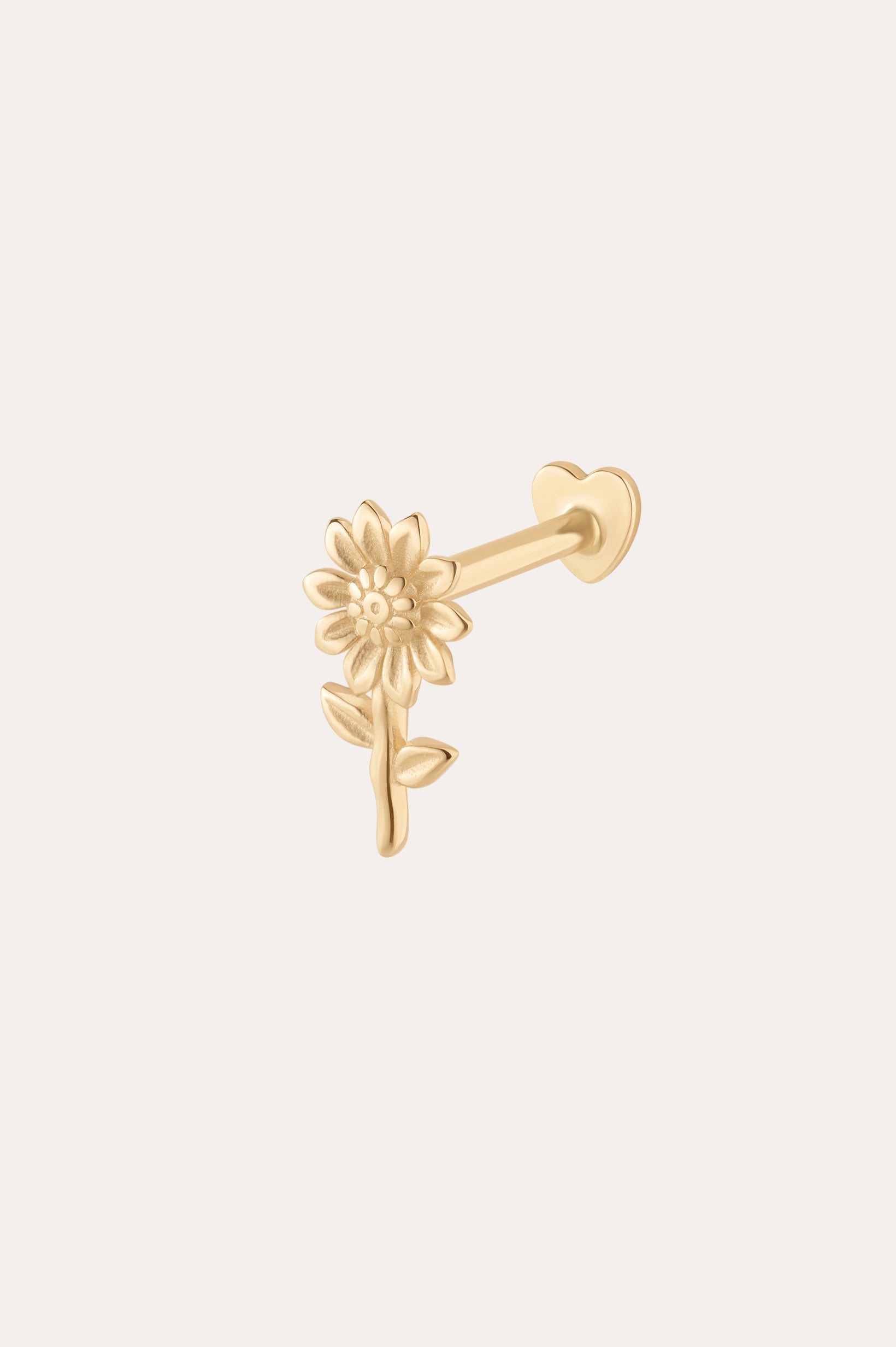 The 14K Solid Yellow Gold Sunflower Flat Back Stud features a detailed sunflower design in 14K yellow gold with a straight post and flat back, making it an elegant and stylish piercing jewelry choice.