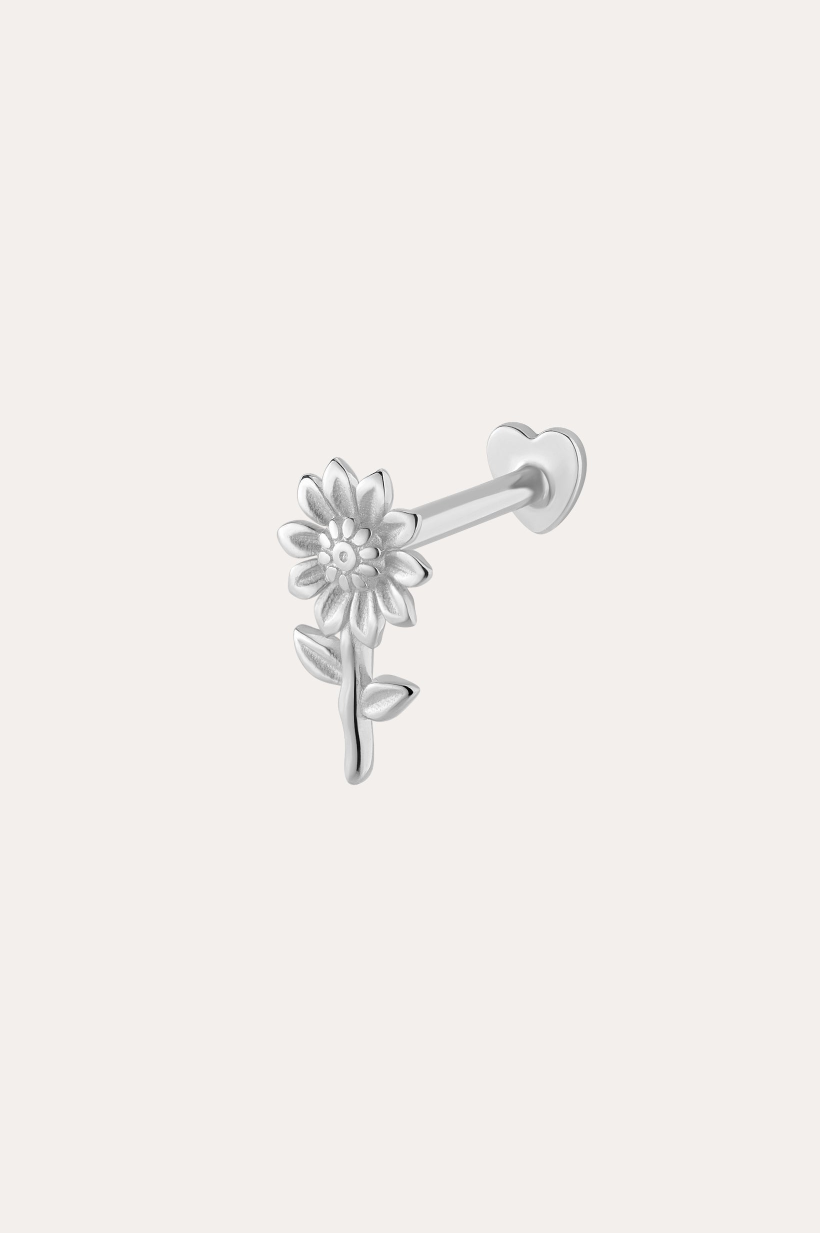 The 14K Solid White Gold Sunflower Flat Back Stud, crafted in 14K white gold and featuring a floral design, makes elegant piercing jewelry and is displayed against a plain light background.