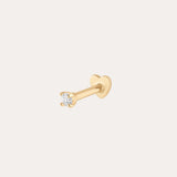 A 14K solid yellow gold flat back stud featuring a 1.5mm lab-grown diamond in a prong setting, shown against a plain light background.