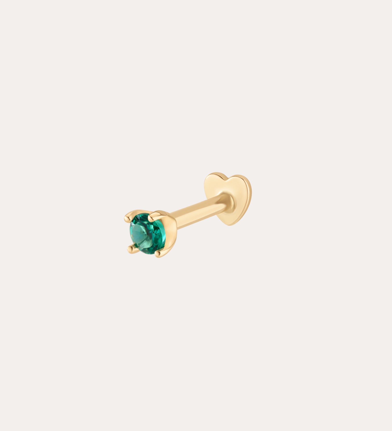 The 14K Solid Yellow Gold Green Emerald Flat Back Stud - 2mm features a round green emerald in four prongs with a heart-shaped backing, shown on a plain light background.