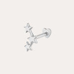 The 14K Solid White Gold Star Cluster Flat Back Stud features three stars in a vertical row and a heart-shaped backing, perfect for piercings. Shown against a plain light background.