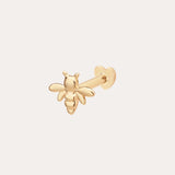 The 14K Solid Yellow Gold Busy Bee Flat Back Stud features detailed wings and body, a straight post, and a heart-shaped flat back, displayed on a plain light background.