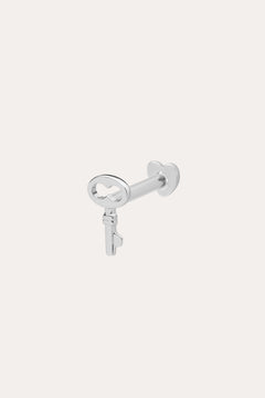 The 14K Solid White Gold Key Flat Back Stud, crafted in 14K white gold, is shown against a light background—ideal as a chic cartilage earring.