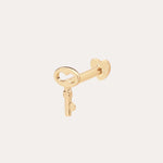 The 14K Solid Yellow Gold Key Flat Back Stud features a heart-shaped bow and is shown in 14K yellow gold against a simple, light background.