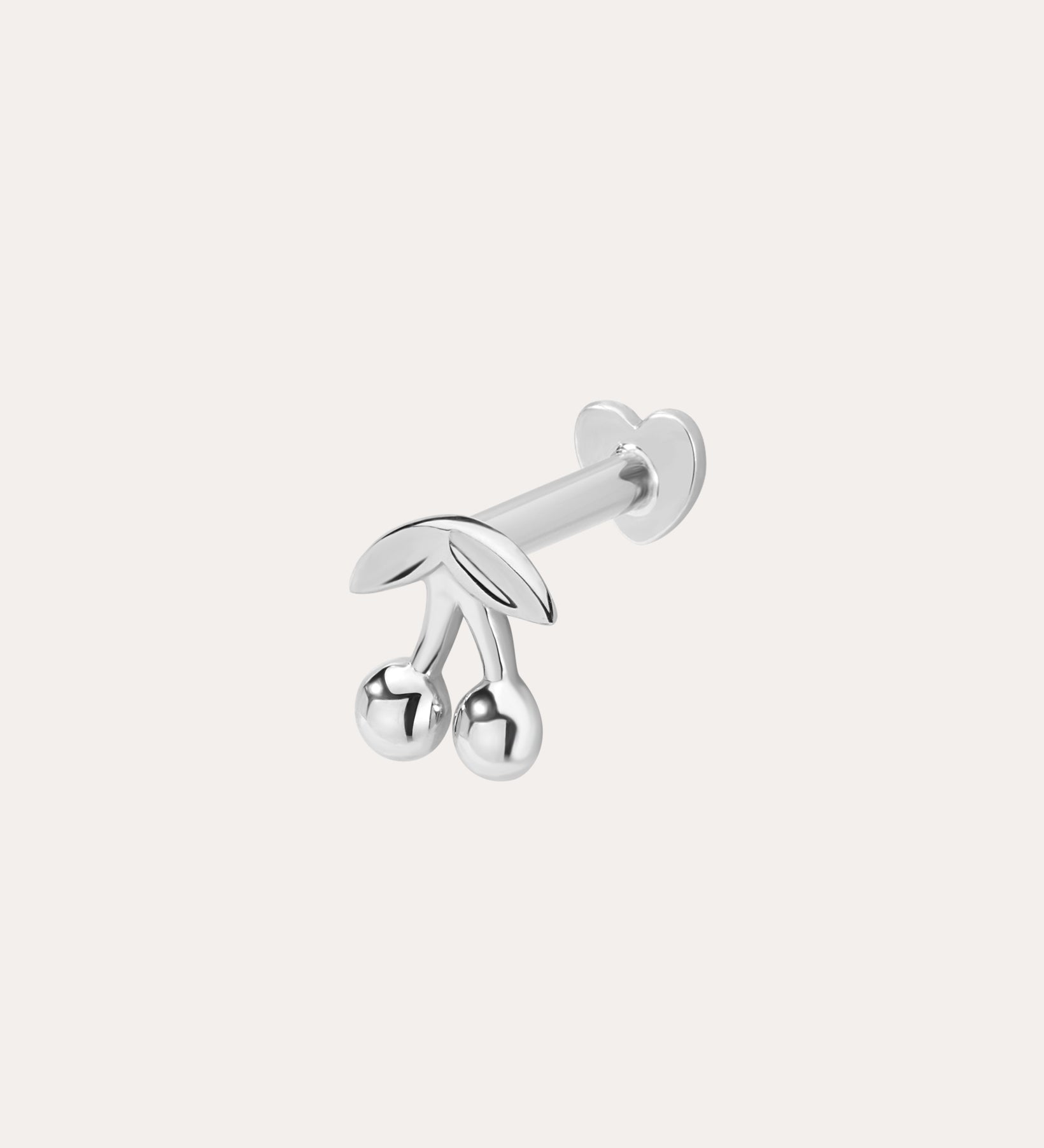 The 14K Solid White Gold Cherry Flat Back Stud, featuring two round cherry fruits and delicate leaves, stands out as elegant body jewelry against a plain light background.