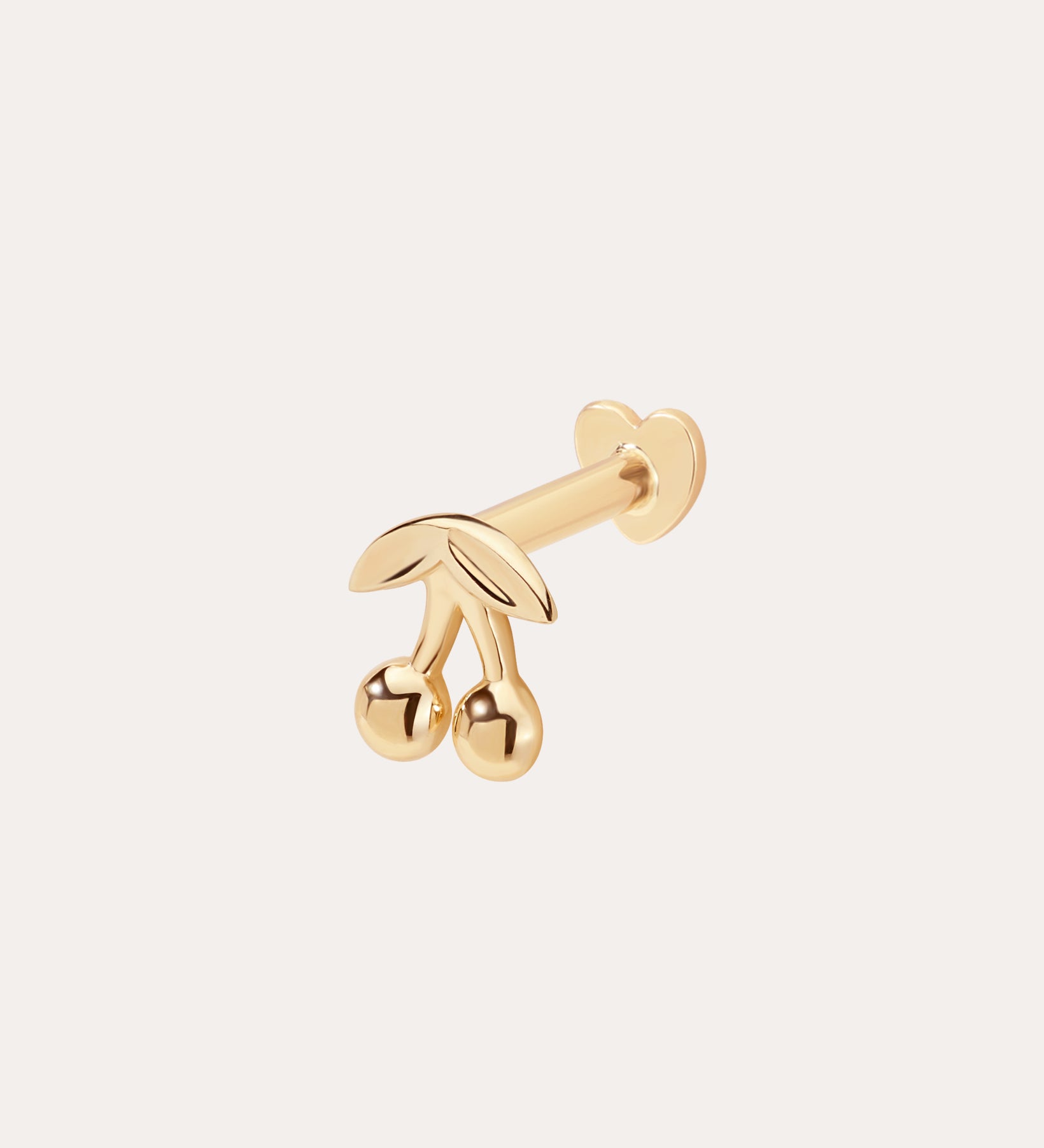 The 14K Solid Yellow Gold Cherry Flat Back Stud features two cherries with leaves and a rounded backing, designed as elegant body jewellery and displayed against a plain light background.