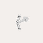 The 14K Solid White Gold Curved Ball Flat Back Stud features six shiny round beads in a curved line, shown on a plain white background—an elegant choice for body jewellery.
