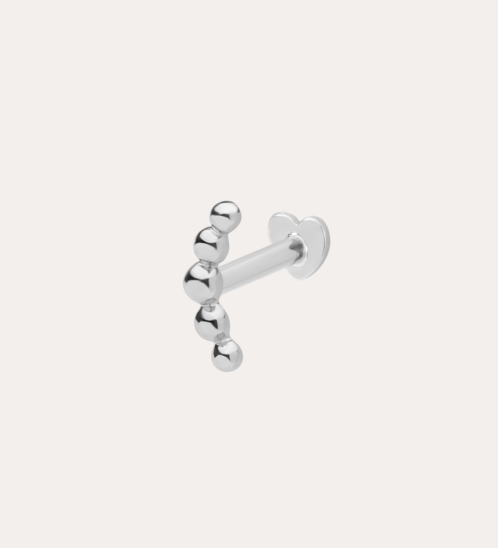 The 14K Solid White Gold Curved Ball Flat Back Stud features six shiny round beads in a curved line, shown on a plain white background—an elegant choice for body jewellery.