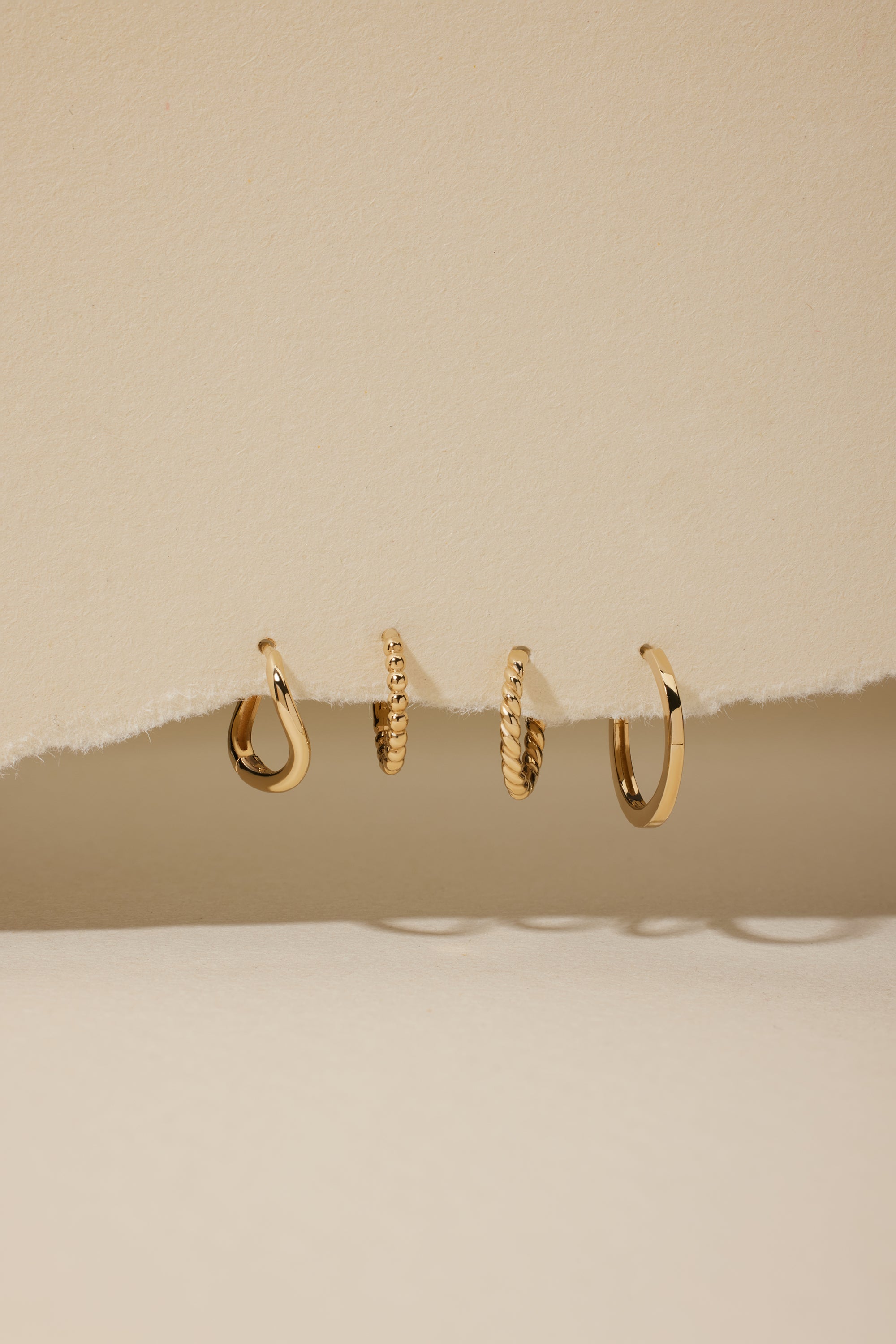 Solid Gold Huggie Collection