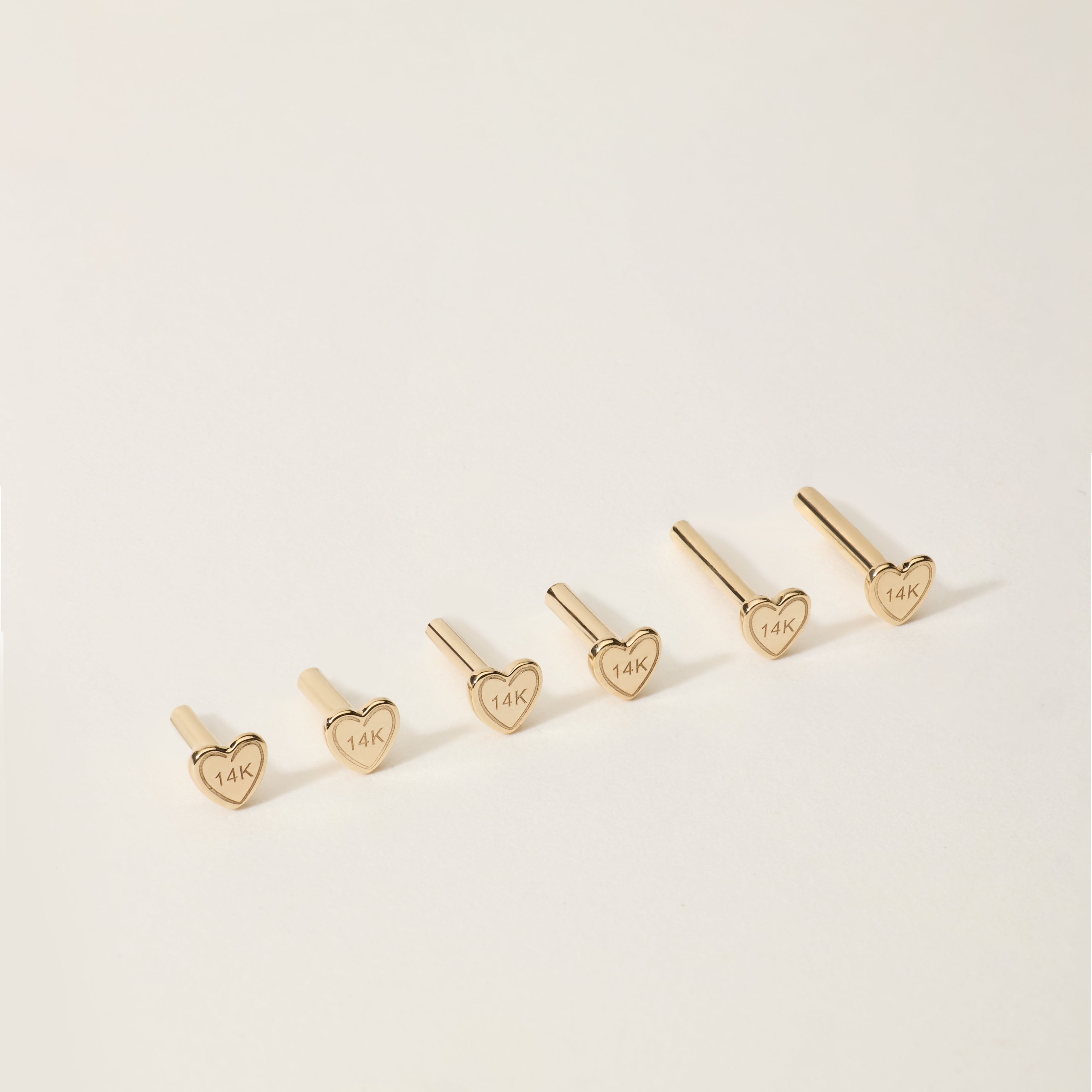 Six titanium studs (16G, 1.2mm) with 5mm labret bars are arranged in a row on a light background—ideal for lobe piercings or adding to your 16G jewelry collection.