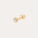 The 14K Solid Yellow Gold Bezel Set Lab-grown Diamond Flat Back Stud showcases a round lab-grown diamond in a bezel setting, displayed against a plain light background.