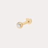 The 14K Solid Yellow Gold Bezel Set Lab-grown Diamond Flat Back Stud showcases a round lab-grown diamond in a bezel setting, displayed against a plain light background.