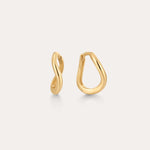 The 14K Recycled Solid Gold Twisted Huggie Earrings feature smooth, wavy, organic shapes and an asymmetrical design. These mini hoops are crafted from recycled gold and displayed on a plain light background.