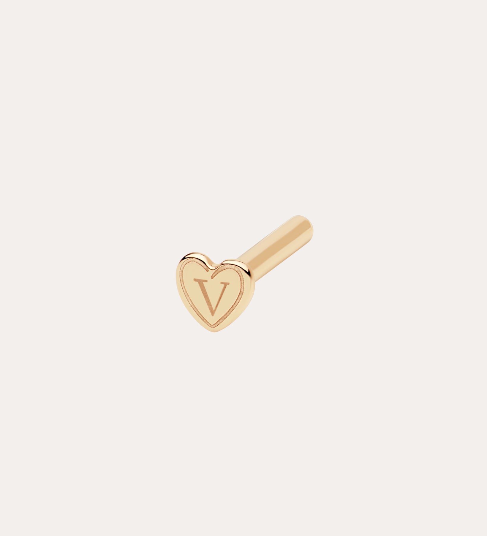 A small gold 18G(1mm) / 8mm Flat Back Post earring with a heart-shaped front engraved with the letter V, pictured on a plain white background.