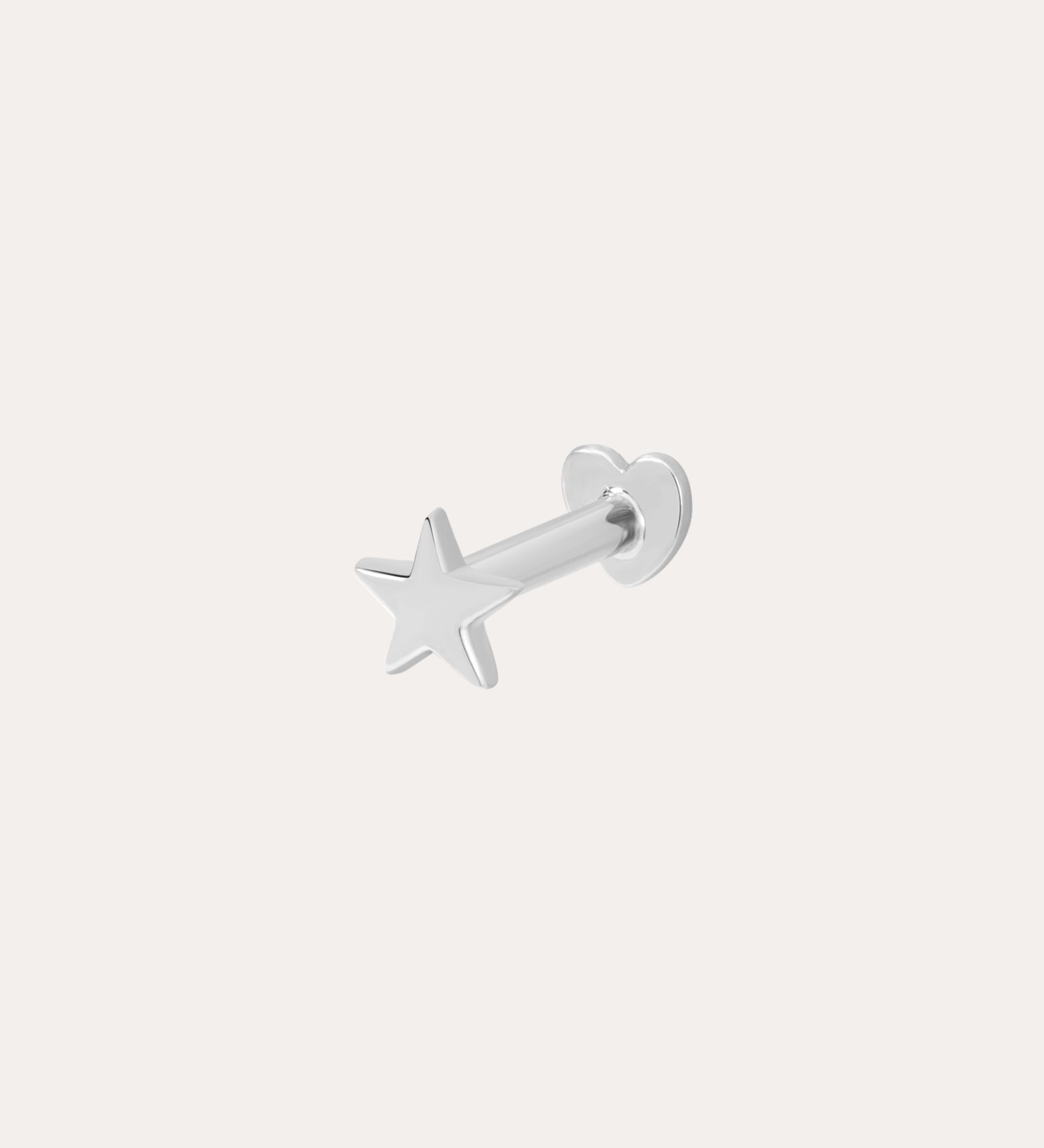 The 14K Solid White Gold Mini Star Flat Back Stud features a five-pointed star front and a smooth circular backing, offering subtle celestial charm to your style against a plain white background.