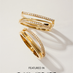 The Noor Pavé Triple Band Rings in Gold, featuring rows of sparkling pavé diamonds, are displayed on a white surface with soft shadows. Below the rings, the text reads Featured in VOGUE.