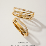 The Noor Pavé Triple Band Rings in Gold, featuring rows of sparkling pavé diamonds, are displayed on a white surface with soft shadows. Below the rings, the text reads Featured in VOGUE.